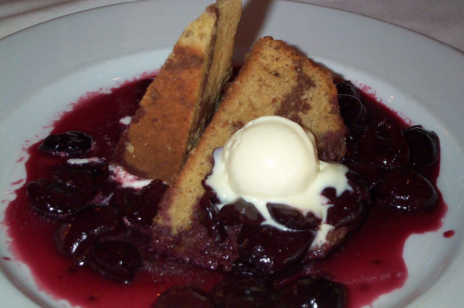 Cherries jubilee is prepared with cherries flambéed with liqueur and served over ice cream.