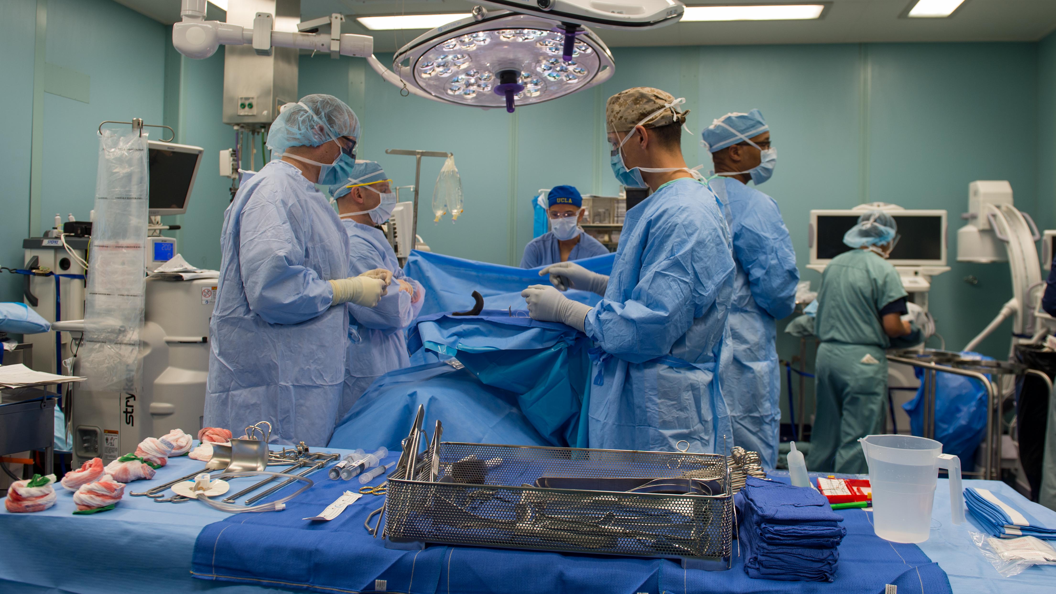 Sailors perform surgery