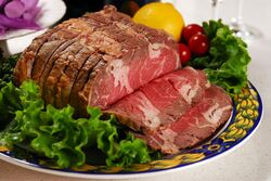 a chunk of beef with salad