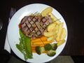 A grilled sirloin steak, a popular dish in North American cuisine.