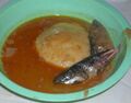 Fufu in groundnut soup with fish – a West African dish