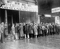 Unemployed men queued outside a depression soup kitchen opened in Chicago by Al Capone, 1931