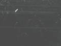An animated cloud chamber with visible particle paths.