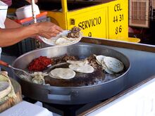 Tacos de suadero (grey) and chorizo (red)