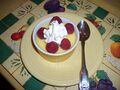 Pudding with raspberries and whipped cream