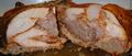 Cross-section of a turducken showing the layers of turkey, duck, and chicken